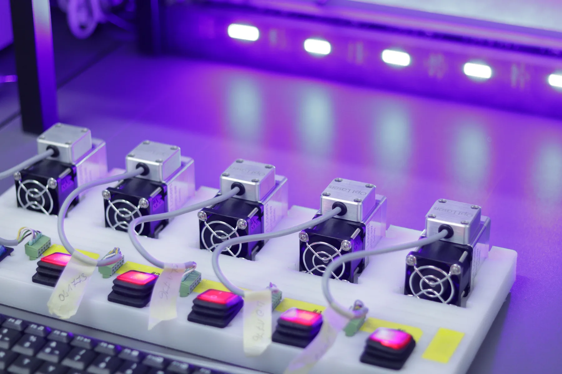 Multiple connected electronic modules arranged on a test fixture