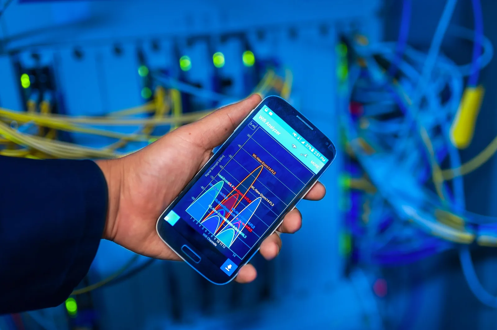 Illustrative wireless evaluation using a phone signal analyzer near network equipment